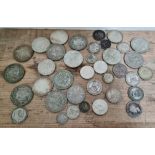 A tin of assorted coins to include half crowns, shillings, two shillings, sixpences & a threepence.