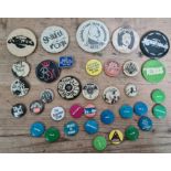 A collection of vintage music related pin badges to include Stiff records, Elvis Costello, Sex