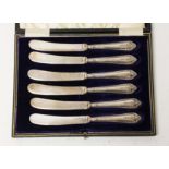 A cased set of six hallmarked silver handle knives.