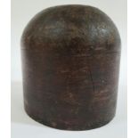 A wooden wig stand/hat block.