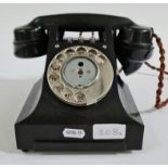 A black bakelite GPO telephone no. 164 58.
