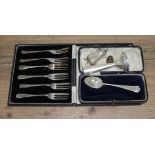 Hallmarked silver comprising a cased set of six cake forks, a pepper pot, a vase and a spoon.