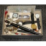 A box of assorted items including wristwatches, coins, pens, a banknote etc.
