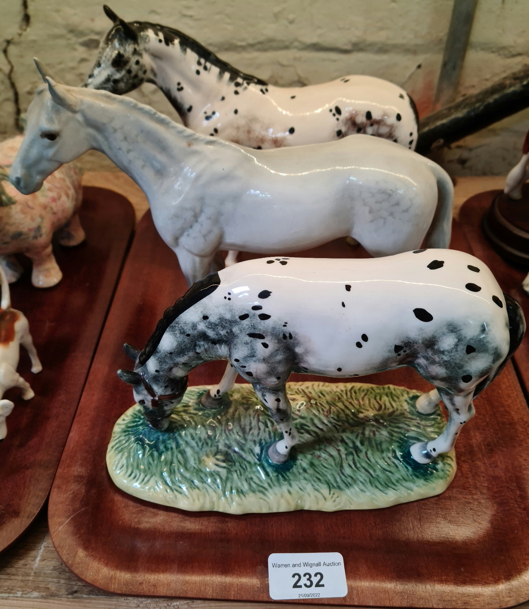 Two Royal Doulton horses and one Beswick.