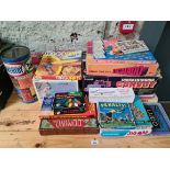 Assorted vintage board games and toys.