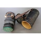 A WWII ARP issue gas mask in original tin / carry case and dated 18/01/1937.