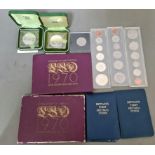 A box of various coin sets and commemorative coins to include 2 boxed 1972 crowns, 2 coinage of