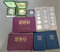 A box of various coin sets and commemorative coins to include 2 boxed 1972 crowns, 2 coinage of