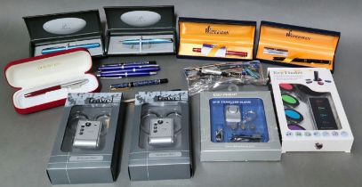 A selection of mini traveller alarms, briefcase alarms together with collection of various pens to
