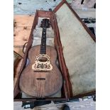 A vintage 8 string Ukelele in mahogany case.