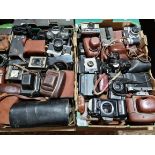 Two boxes of cameras and camera equipment including Praktica, Polaroid, Nikon etc.
