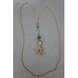 A vintage gilt metal and green bead necklace, drop length 13cm, chain length 82cm.