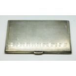 A hallmarked silver Art Deco style cigarette case, length 14cm, gross wt. 7.1ozt.