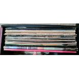 A case of records including The Beatles, David Bowie, The Rolling Stones etc.