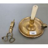 An early 19th century brass candlestick and snuffer.