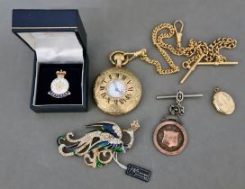 A mixed lot including a 9ct gold front and back locket, a hallmarked silver fob, a modern pocket