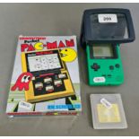 A Grandstand Pocket Pac Man and a Nintendo Gameboy Pocket.