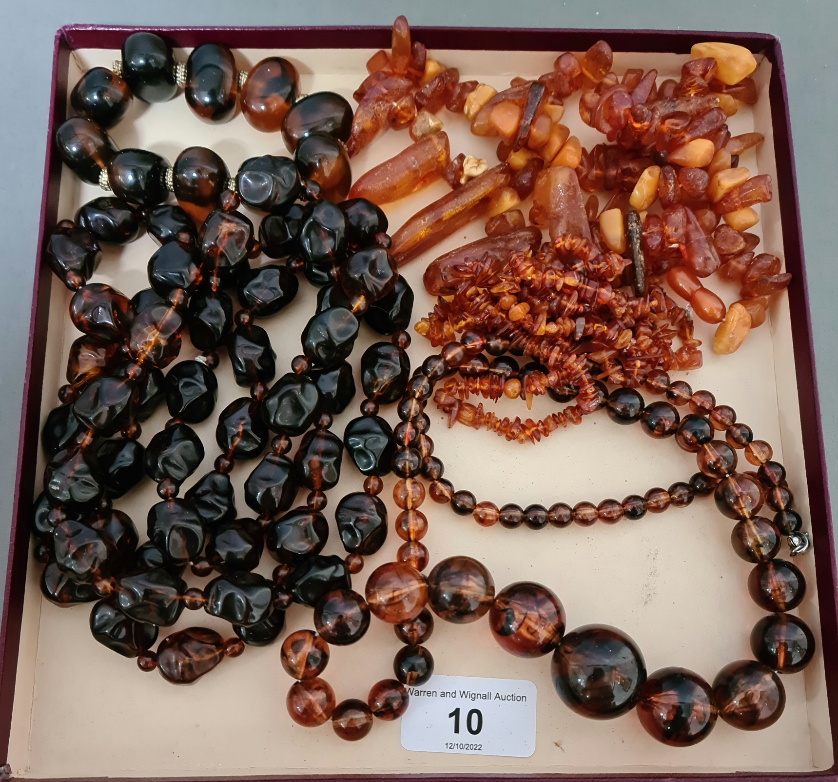 Assorted amber and similar beads.