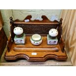 Edwardian oak standish with ceramic inkwells.