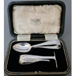 A child's christening silver spoon and pusher set with associated box, Sheffield, 1938, Thomas