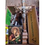 A box of religious items including two crucifixes, a bible and a religious icon.