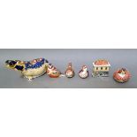 6 Crown Derby pieces to include hippo, 1 china shop and 4 birds, 4 with gold stoppers, 1 ceramic and