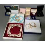 A selection of mainly boxed costume jewellery including Swarovski, Royal Albert bone china brooch,