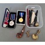A mixed lot including medals, penknives, pens, pipe etc.