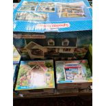 Boxed Sylvanian families toy sets; House on the Hill, Stable & Pony, and Hazelwood Toy Shop.