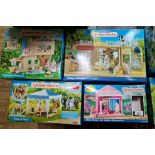 Boxed Sylvanian families toy sets; Village Bakery, Primrose Nursery, Pony & Trap and Village