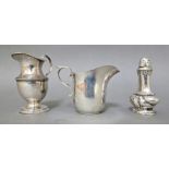 Two silver cream jugs and a pepper pot, various hallmarks, gross weight 182 grams.