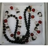 A snowflake obsidian necklace with 14 ct gold clasp and a rock crystal and carnelian necklace with 9
