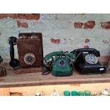 3 vintage telephones to include a black , a green and a wall mounted one.