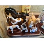 A selection of 7 figures to include 2 Beswick horses, 2 pottery dogs and 3 composite dogs.