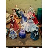 A collection of 10 Royal Doulton figurines.