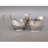 Two hallmarked silver cream jugs, William Aitken, Birmingham 1903 & 1907, wt. 4.2ozt.