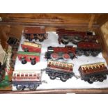 A case containing Hornby 0 gauge clockwork railway comprising three engines, rolling stock and