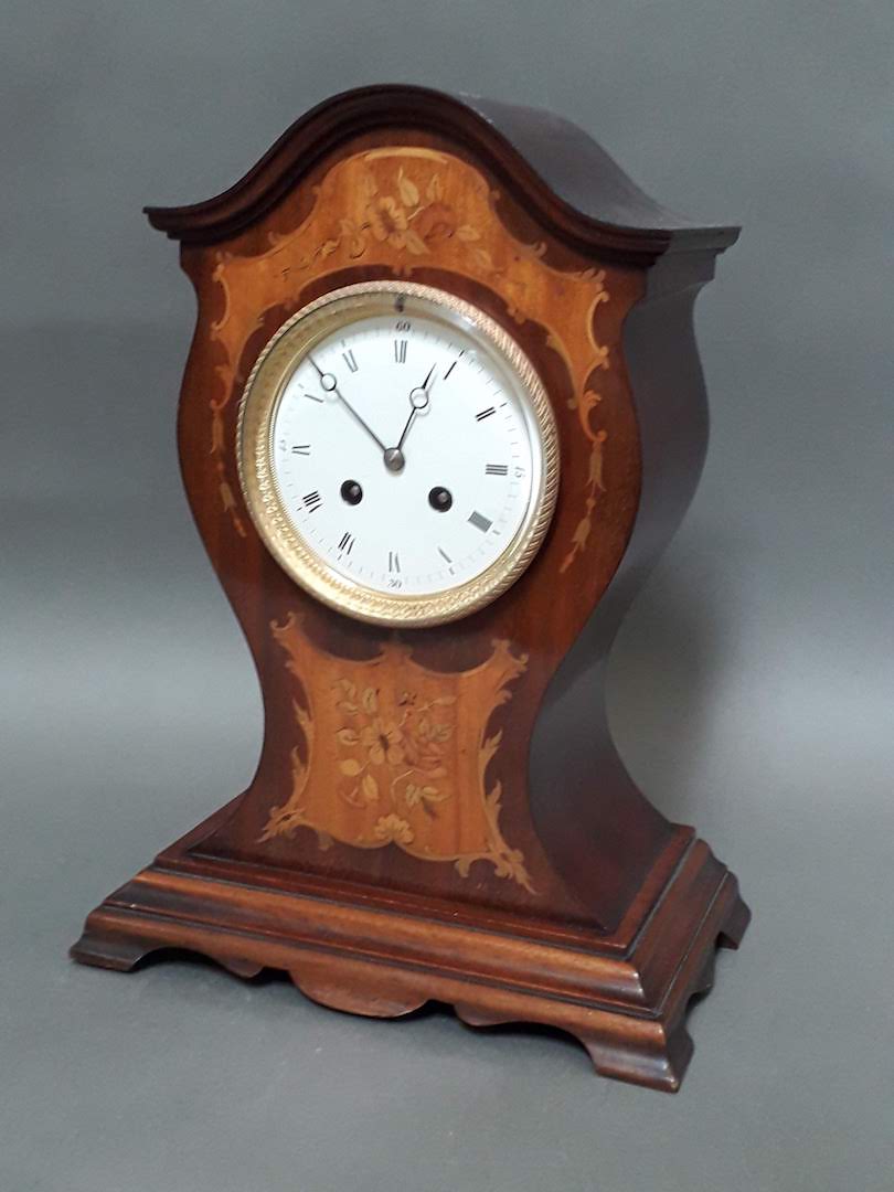 An inlaid mahogany cased Edwardian mantel clock with pendulum and key, height 36cm.