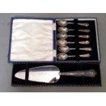 A cased set of 6 silver tea spoons, Sheffield, TS, 1933 together with a silver handled pie server.