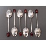 A set of six silver bean spoons with amber finials, William Hair Haseler, Birmingham 1925, gross wt.