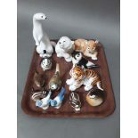 A collection of 13 Lomonosov animal figurines.