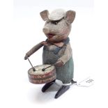 A Schuco clockwork drumming pig with key.