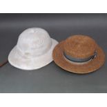 Two vintage hats: a 1940s "Super Comfortease" pith hat and a Ridgmonk straw boater bearing signature