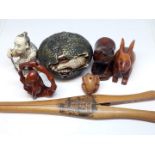 A group of oriental hardwood and resin carvings, together with a a pair of Mauchline ware glove