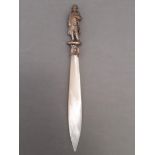 A novelty mother of pearl letter opener with cast finial modelled as Napoleon.