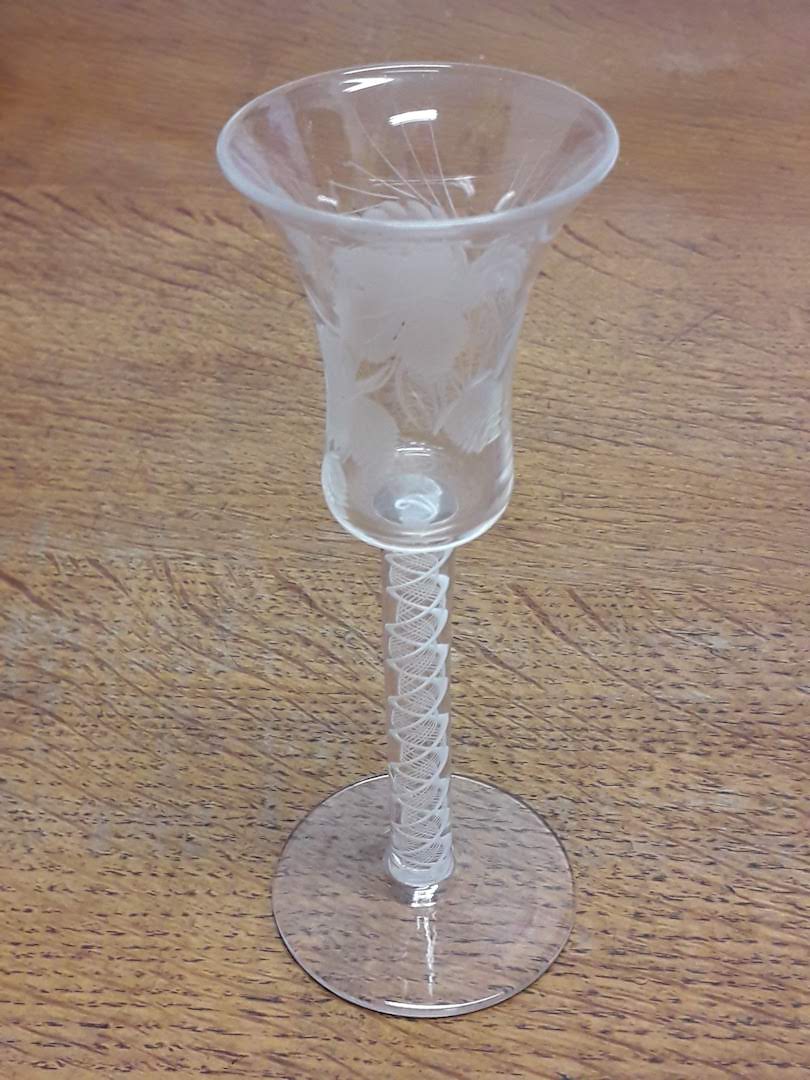 A late 18th century lattice twist stem and etched drinking glass, height 15.5cm.