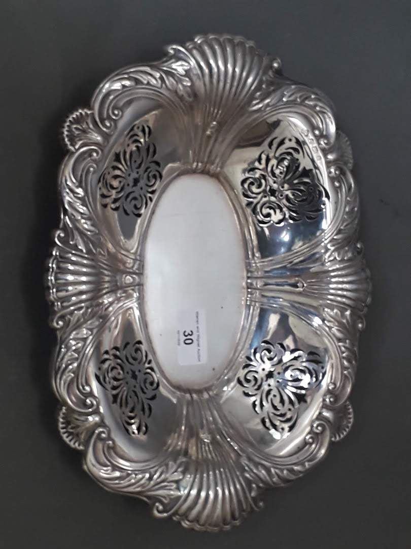 An Edwardian pierced silver dish with embossed shell decoration, Elkington & Co, Birmingham 1906,