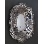 An Edwardian pierced silver dish with embossed shell decoration, Elkington & Co, Birmingham 1906,