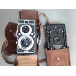 A Zeiss Ikon Ikoflex and a Rajar No. 6 camera.