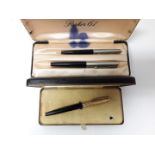 A boxed Watermans fountain pen with nib marked '14ct', together with a Parker 61 set, both with